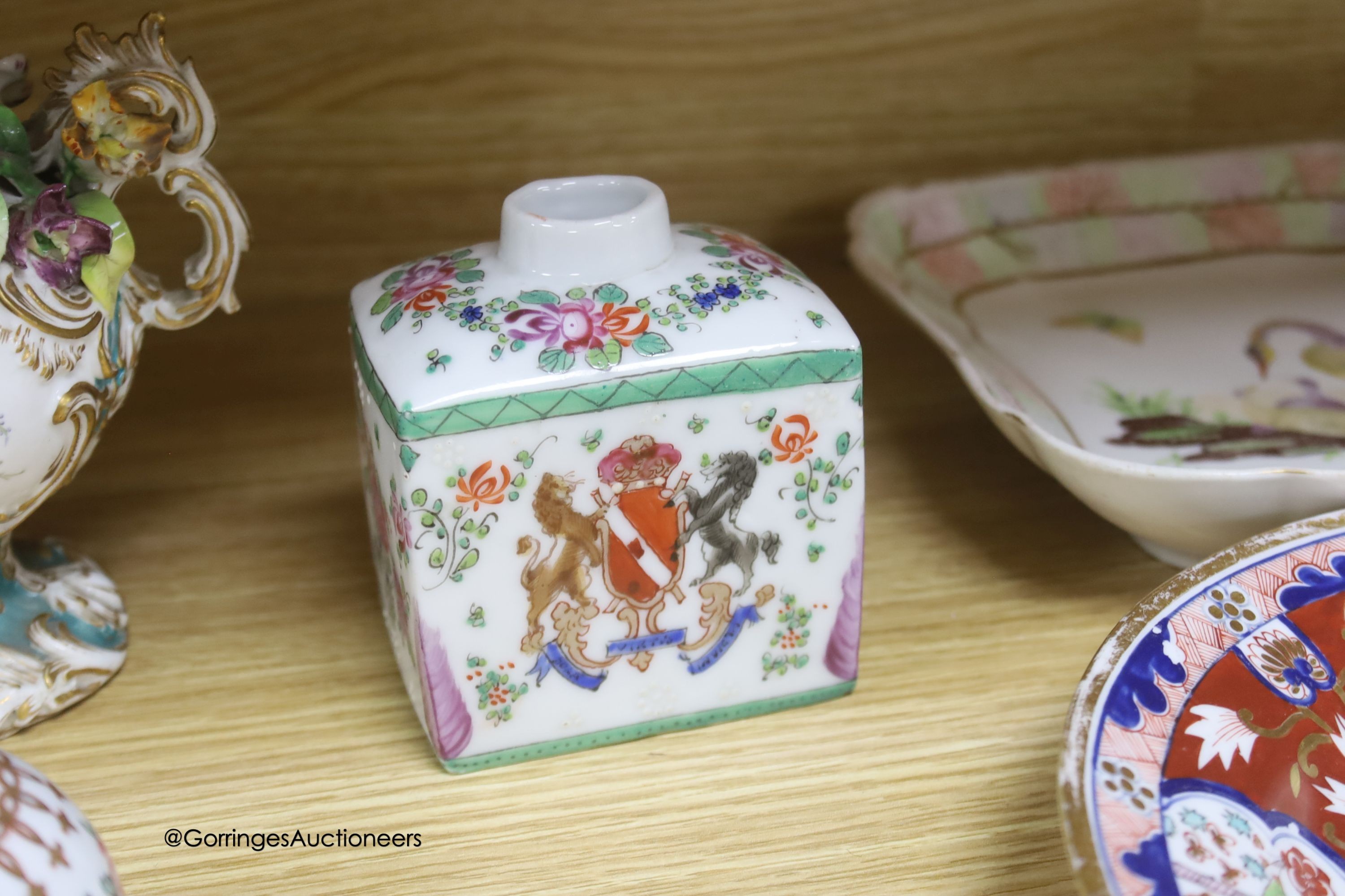 A pair of Rockingham style floral encrusted lidded vases, an armorial jar, two 19th-century English porcelain dishes etc